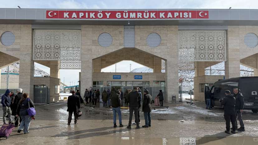 People stand at the Kapikoy Border Gate, between Turkey and Iran, in Van province