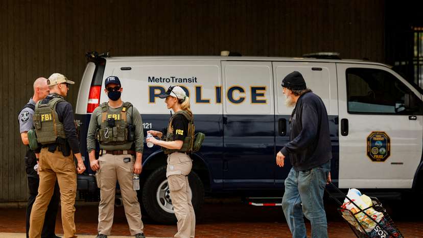 FILE PHOTO: FBI agents gather in front of a Metro Transit Police van near the Anacostia bus station in Washington, D.C.