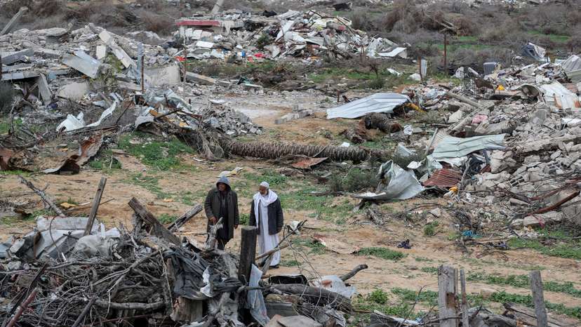 Palestinians view the destruction after Israeli forces withdrew from the Netzarim Corridor, amid a ceasefire between Israel and Hamas, near Gaza City