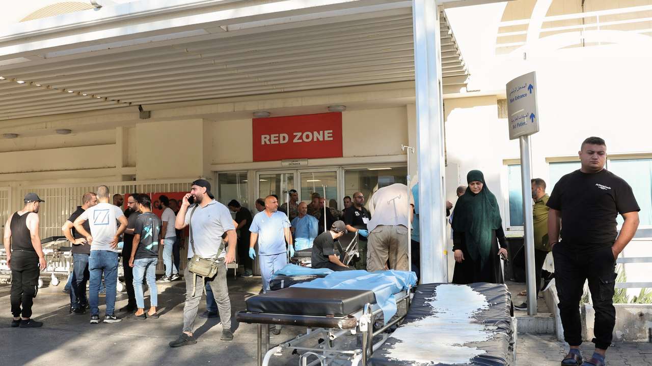 People gather outside a hospital, as hundreds of members of the Lebanese armed group Hezbollah, including fighters and medics, were seriously wounded on Tuesday when the pagers they use to communicate exploded, according to a security source, in Beirut