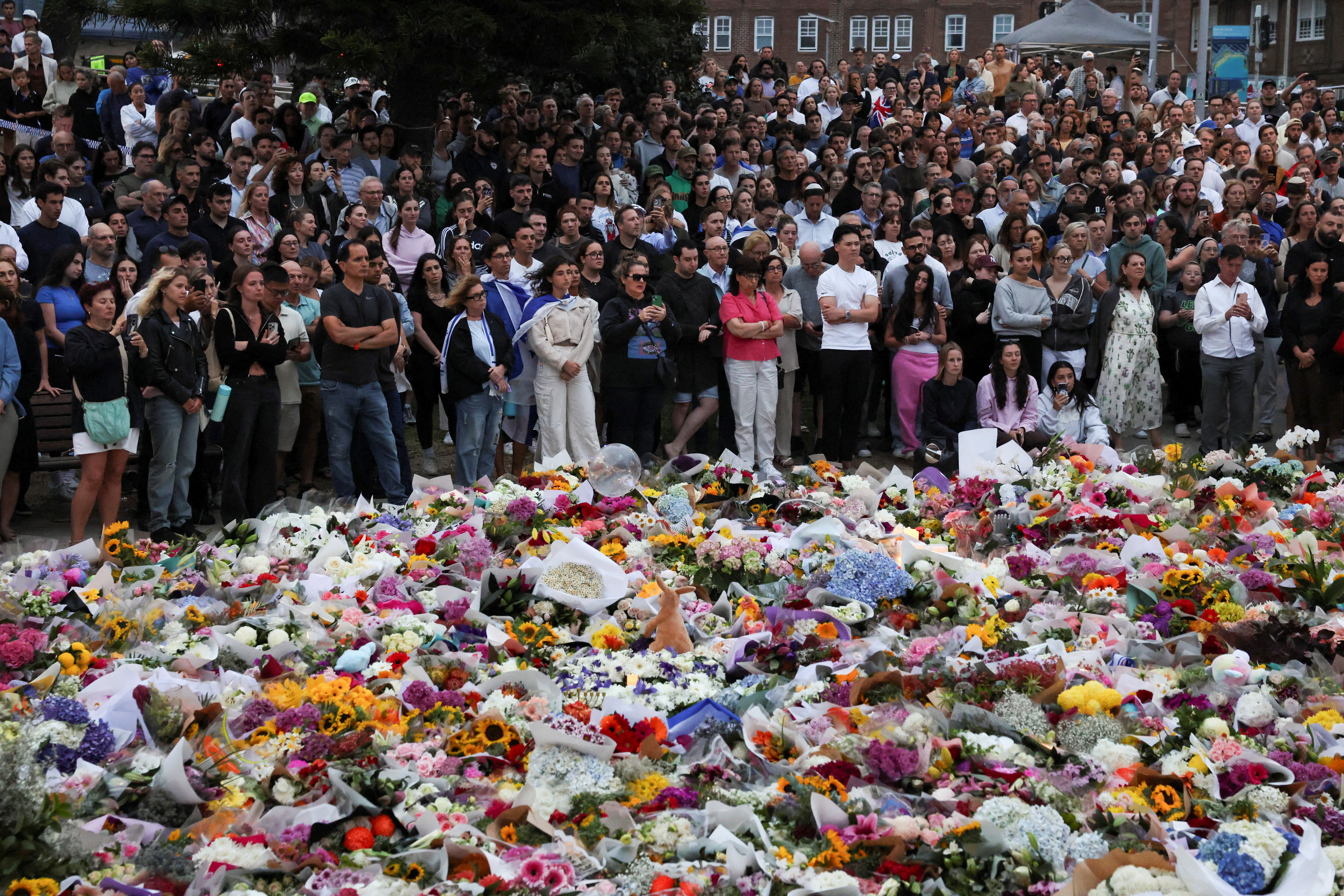 People pay respects at Bondi Pavilion to victims of a shooting during a Jewish holiday celebration at Bondi Beach, in Sydney