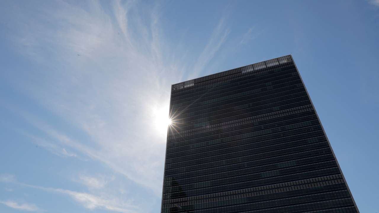 FILE PHOTO: The sun shines behind the United Nations Secretariat Building at the United Nations Headquarters in New York City