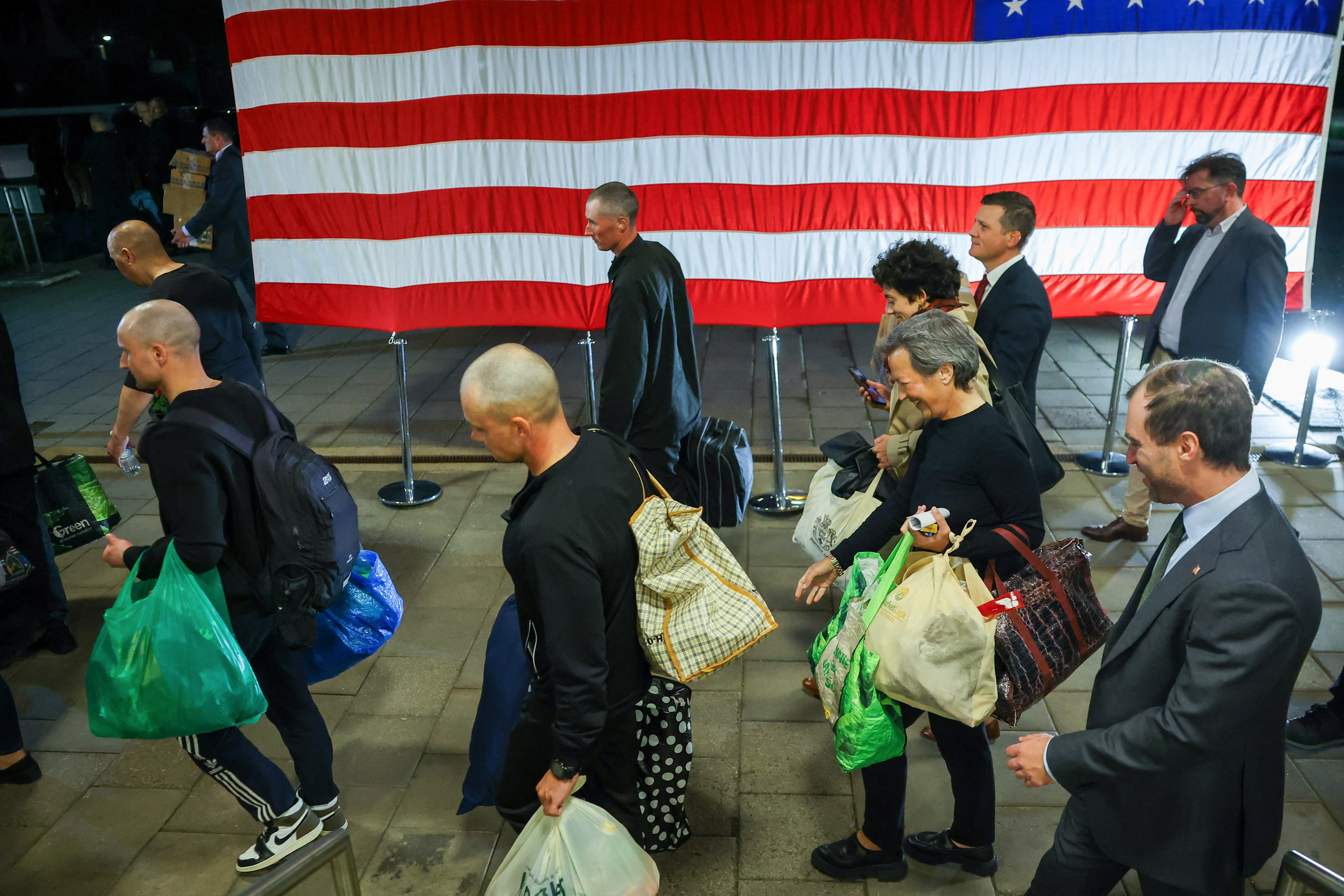 Prisoners released from Belarus are greeted at the U.S. embassy in Vilnius