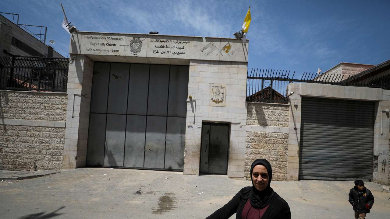 A Palestinian woman walks outside the Holy Family Church after the death of Pope Francis was announced by the Vatican, in Gaza City