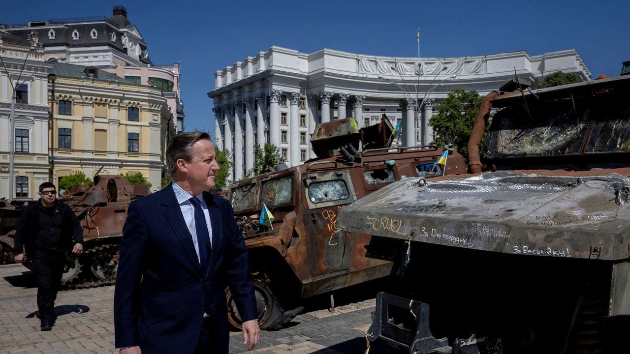 FILE PHOTO: Britain's Foreign Secretary David Cameron and Ukrainian Foreign Minister Dmytro Kuleba meet in Kyiv
