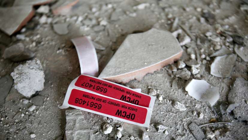 FILE PHOTO: Labels of the Organisation for the Prohibition of Chemical Weapons (OPCW) are seen iside a damaged house in Douma in Damascus