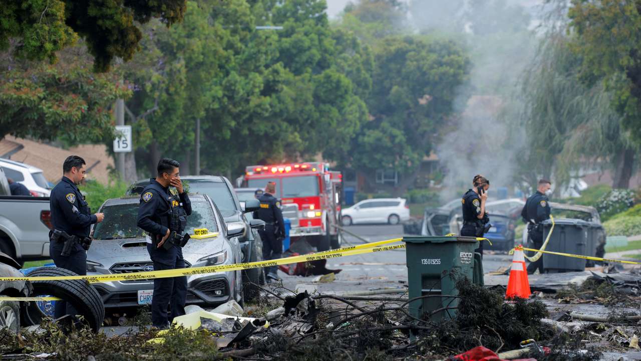 Crash scene after a civilian aircraft went down in a military neighborhood, in San Diego