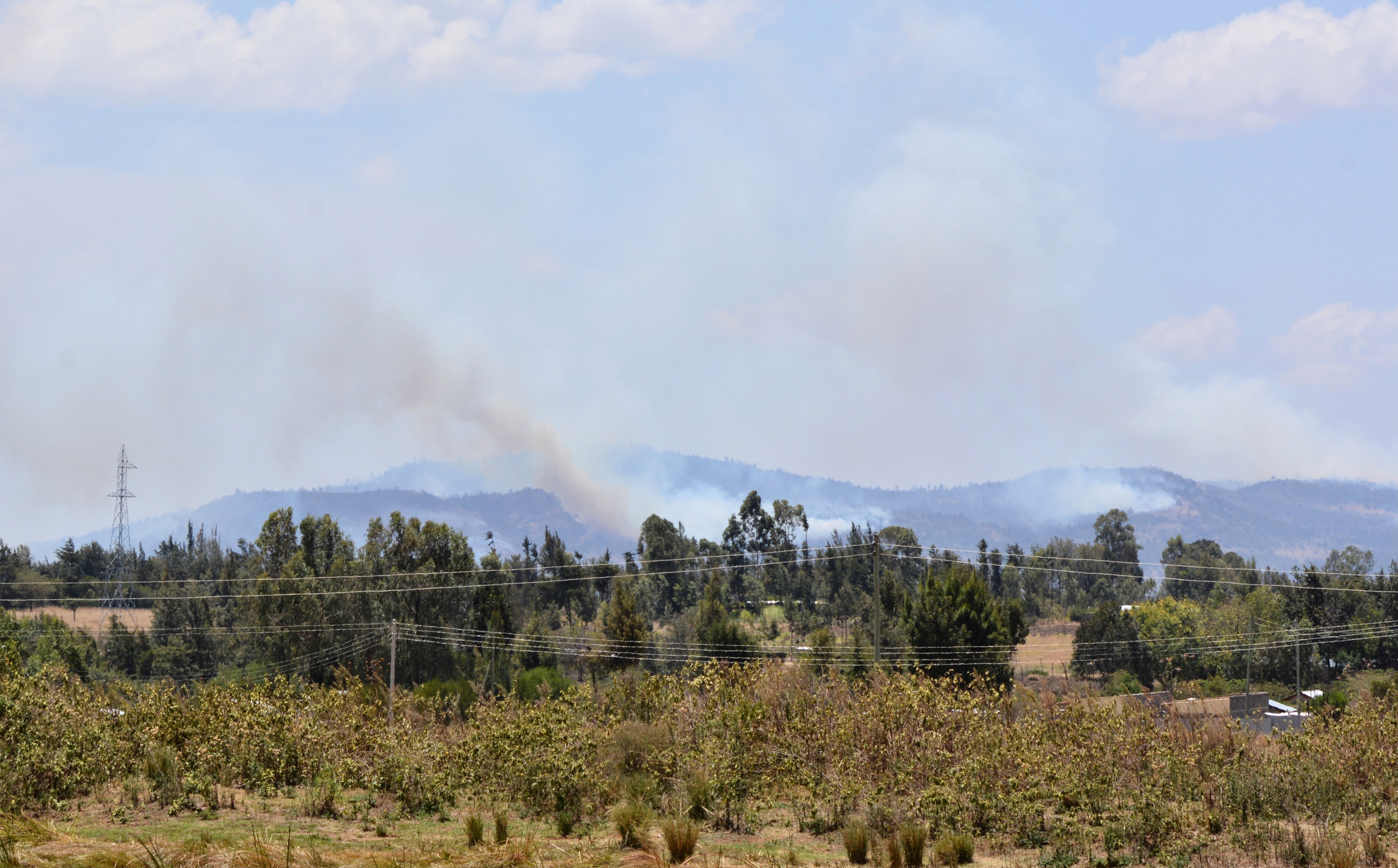 General view shows smoke billowing from a fire that broke out during an exercise by British troops, near Nanyuki