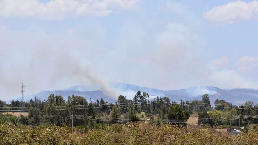 General view shows smoke billowing from a fire that broke out during an exercise by British troops, near Nanyuki