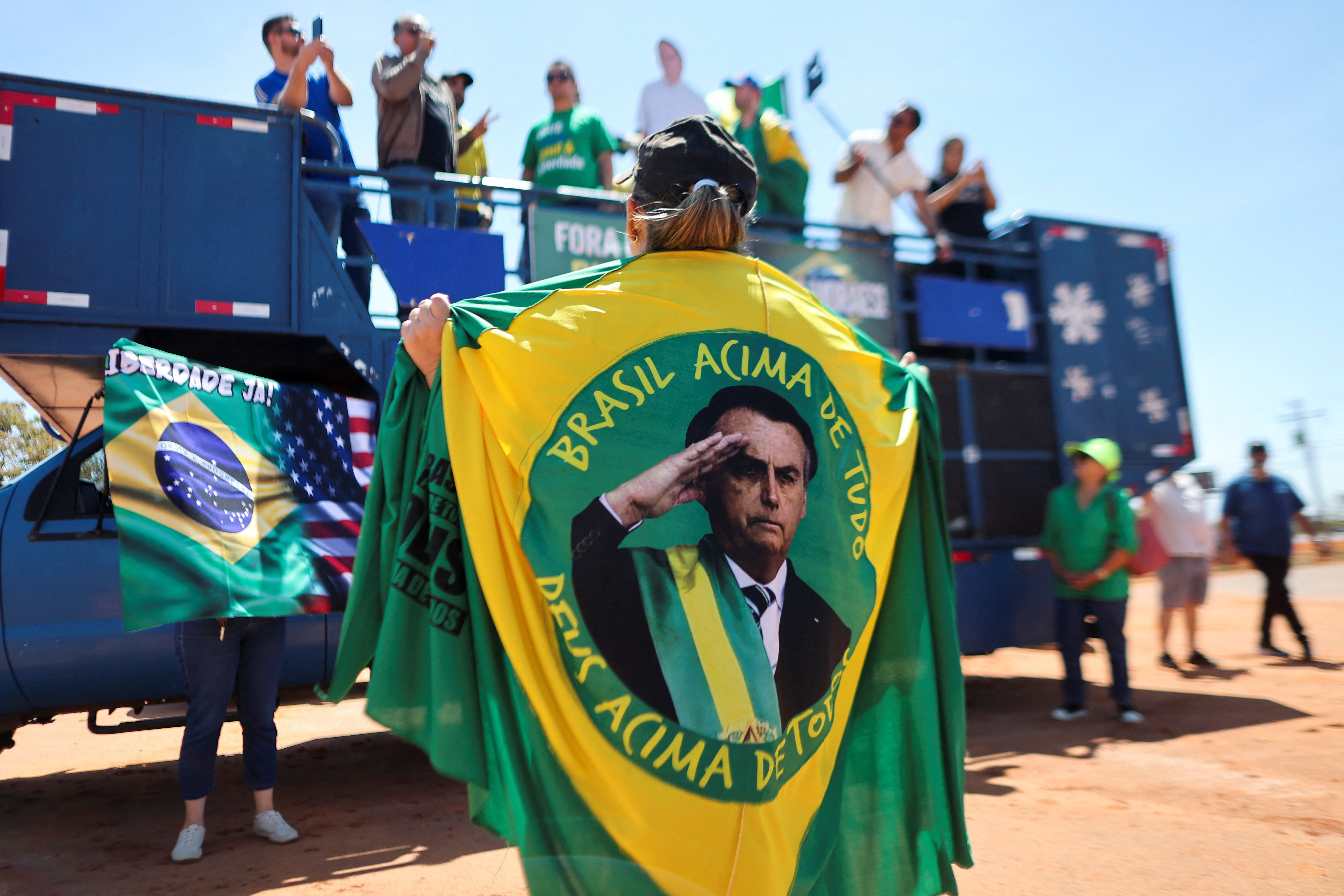 Supporters of former Brazilian President Jair Bolsonaro gather outside his residence, in Brasilia