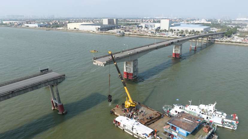 Drone view shows rescue workers at the site where a container ship hit Lixinsha bridge in Guangzhou