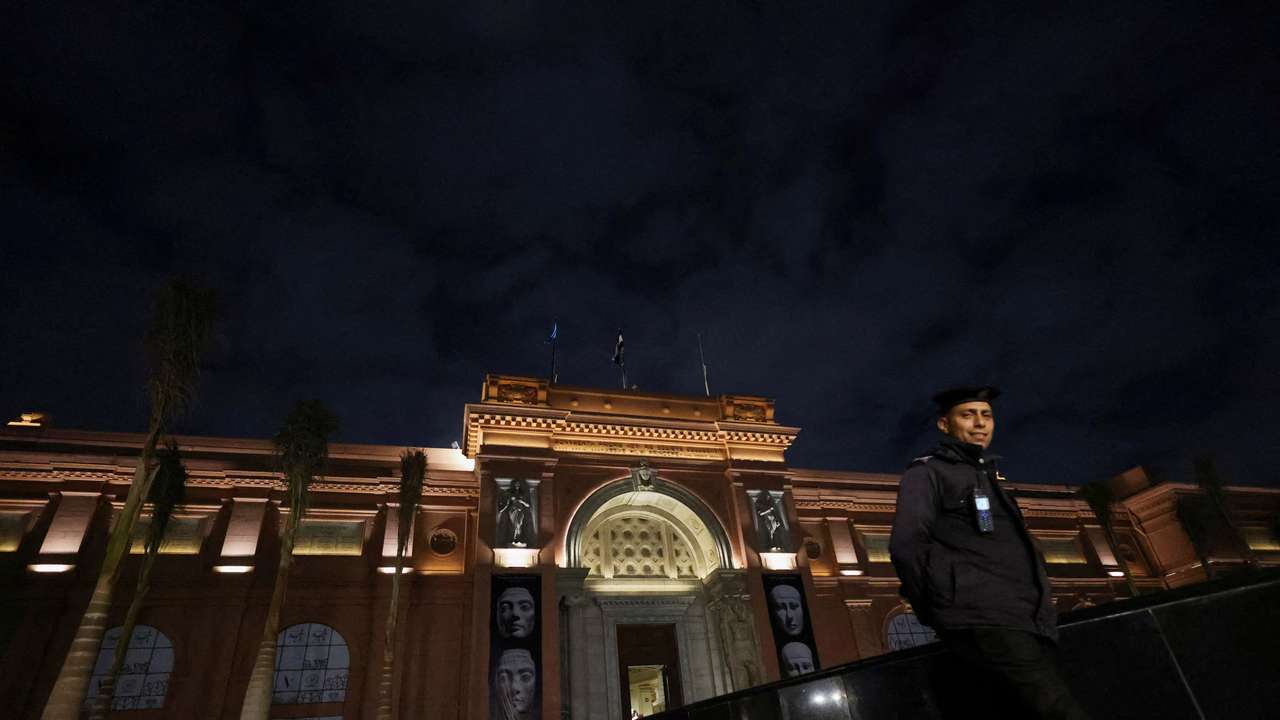 FILE PHOTO: A police officer walks next to an entrance of the Egyptian Museum  in Egypt's capital of Cairo