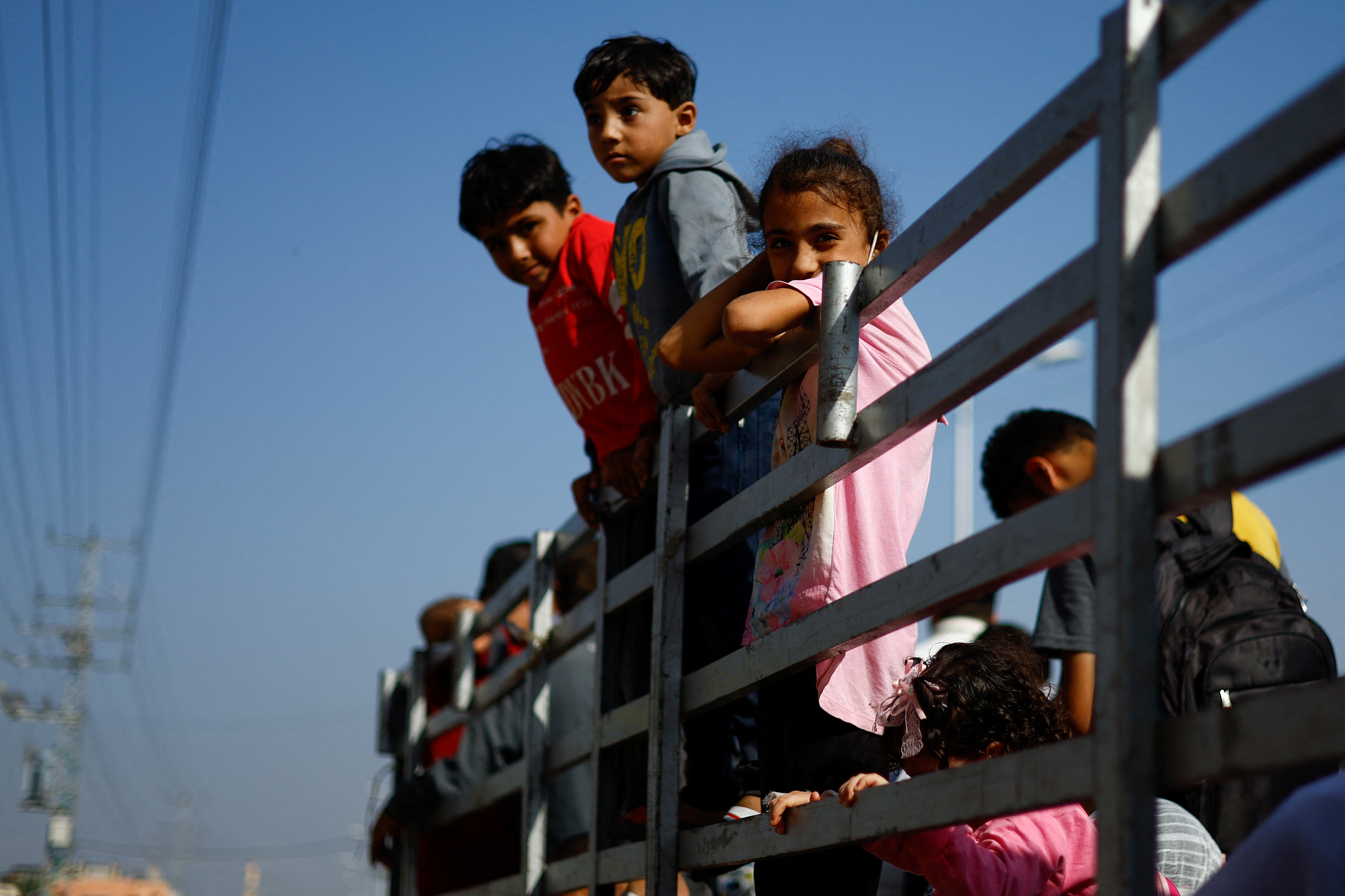 Palestinians flee north Gaza towards the south, amid the ongoing conflict between Israel and Palestinian Islamist group Hamas, in the central Gaza Strip