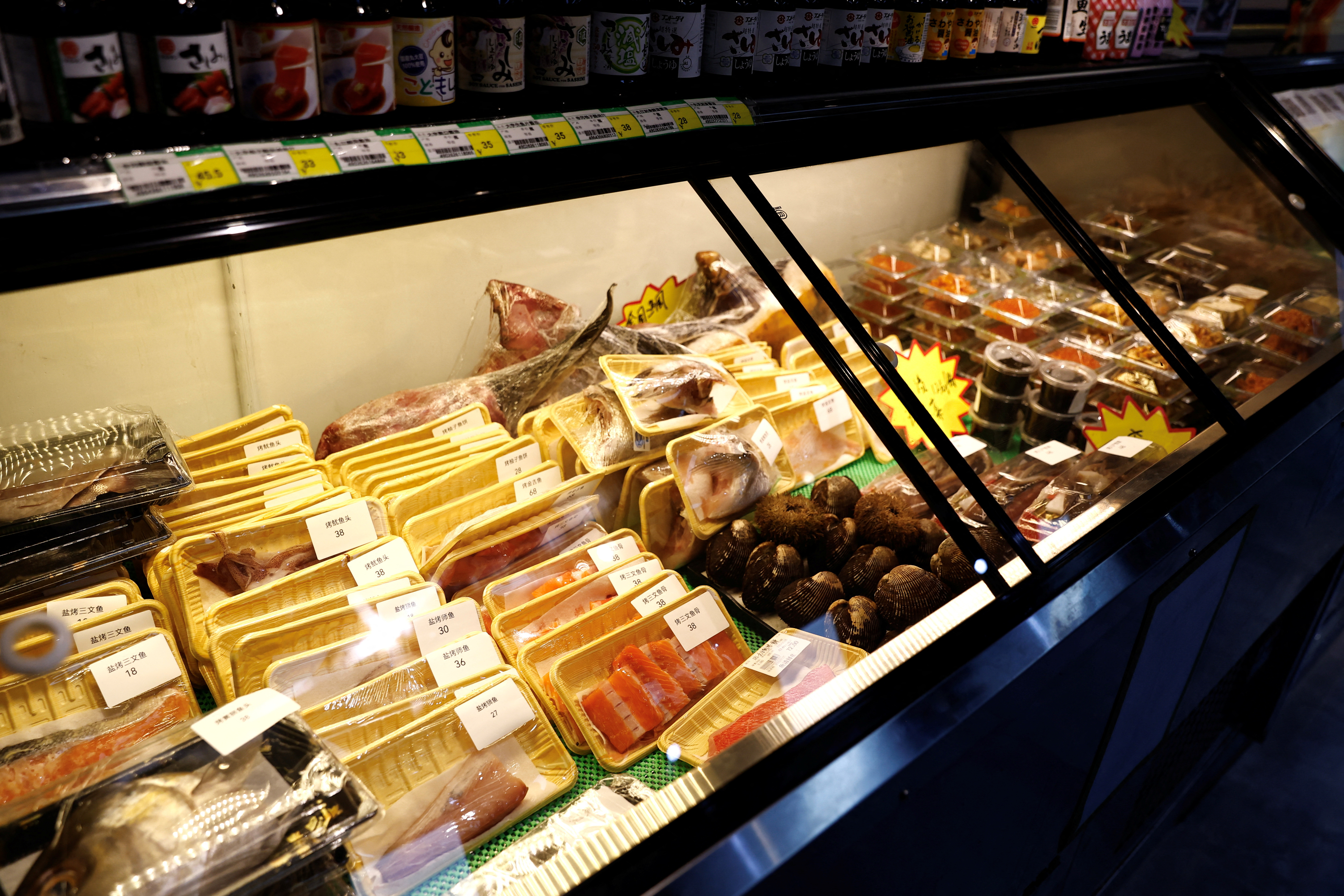 Packs of raw fish are pictured at a Japanese food store, in Beijing