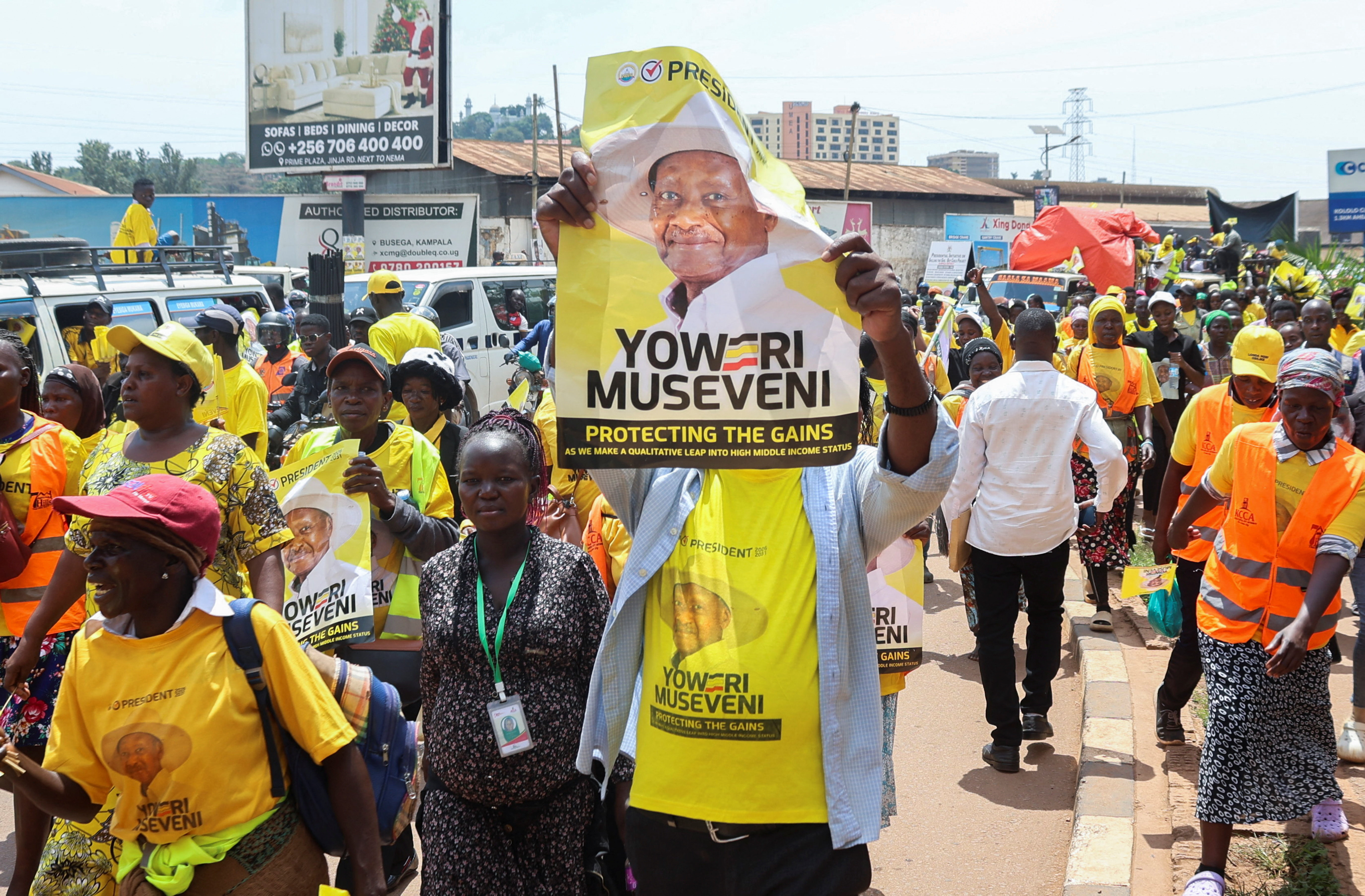 Supporters of Uganda's President and the leader of ruling NRM party Yoweri Museveni, attend his campaign rally in Kampala