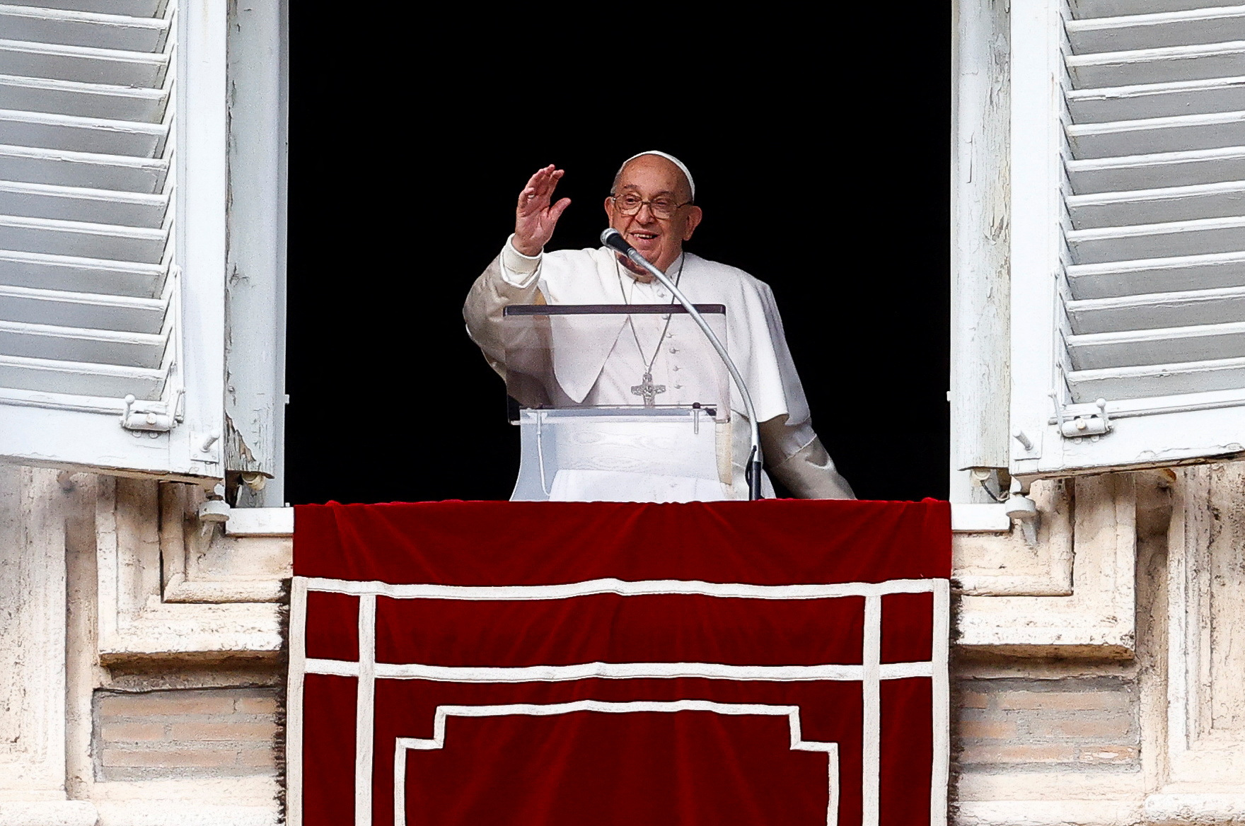 Pope Francis leads the Angelus prayer from his window, at the Vatican