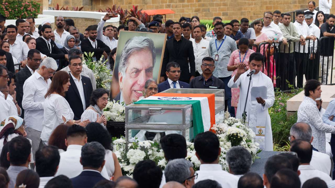 A priest prays during a final viewing for the public to pay their respects to the former chairman of Tata Group Ratan Tata, in Mumbai
