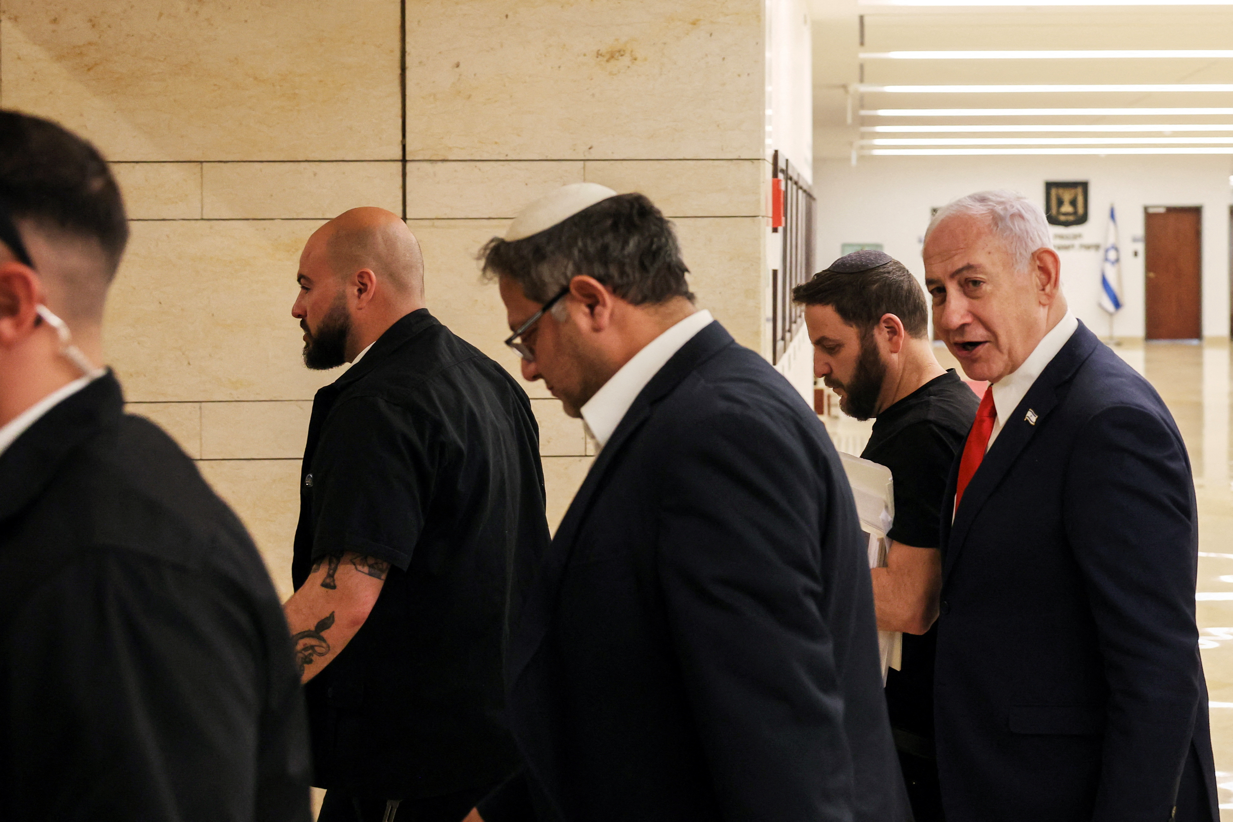 Israeli PM Netanyahu and National Security Minister Ben-Gvir walk together inside Knesset, Israel's parliament, in Jerusalem