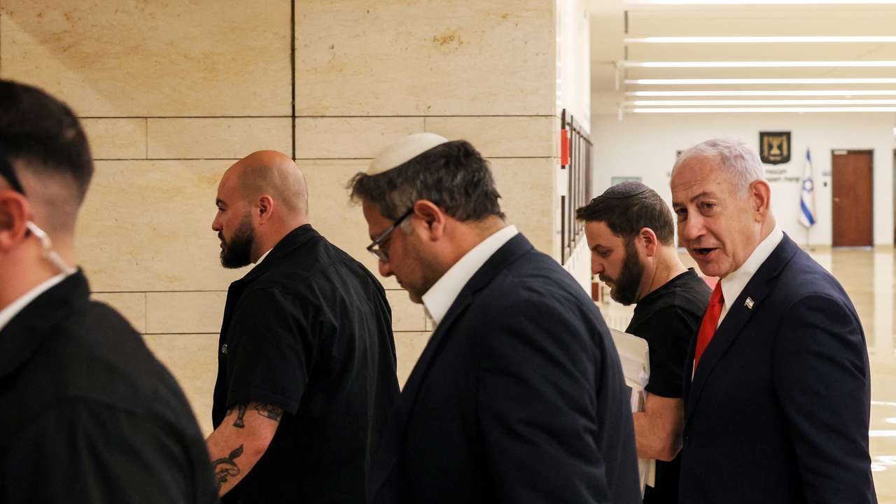 Israeli PM Netanyahu and National Security Minister Ben-Gvir walk together inside Knesset, Israel's parliament, in Jerusalem