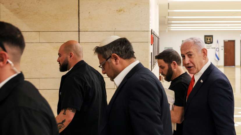 Israeli PM Netanyahu and National Security Minister Ben-Gvir walk together inside Knesset, Israel's parliament, in Jerusalem