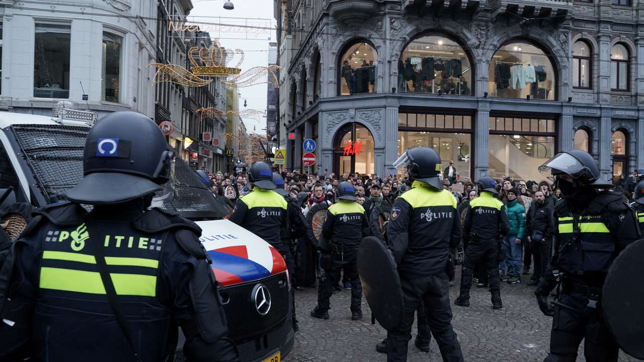 Pro-Palestinian protesters take part in a banned demonstration in Amsterdam