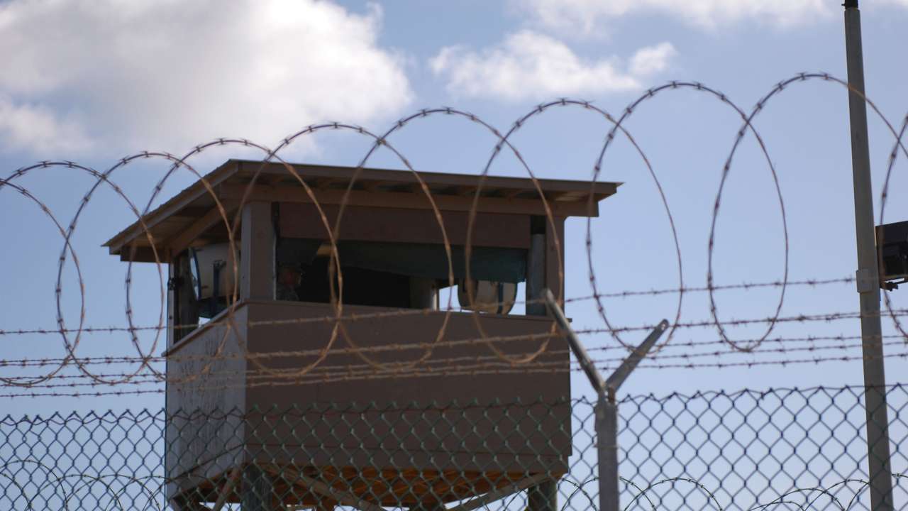 File photo of a soldier standing guard in a tower overlooking Camp Delta at Guantanamo Bay naval base