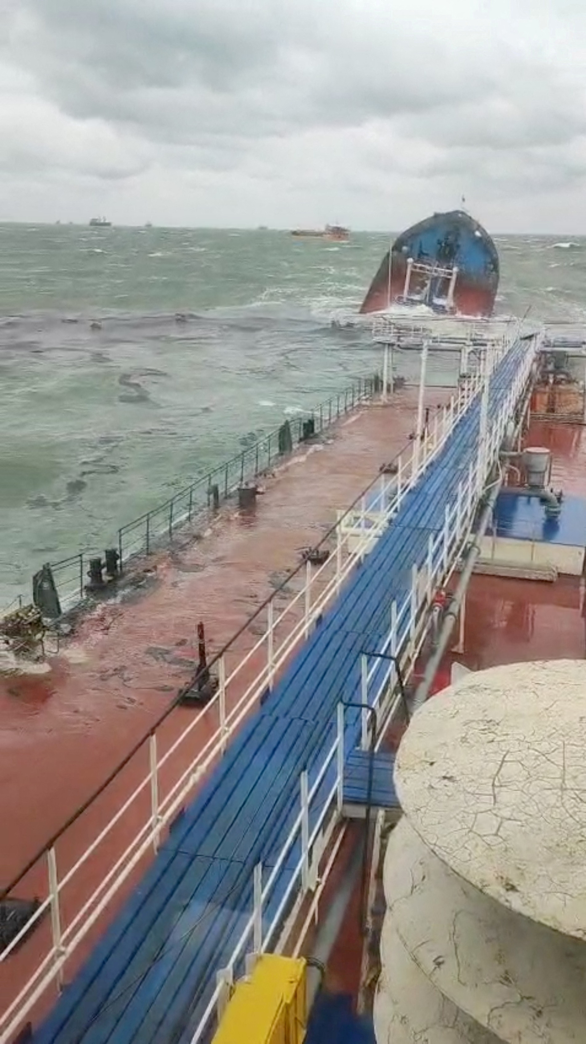 A view from the Volgoneft 239 oil tanker shows the sinking part of the vessel, whose damage caused an oil spill, in the Kerch Strait