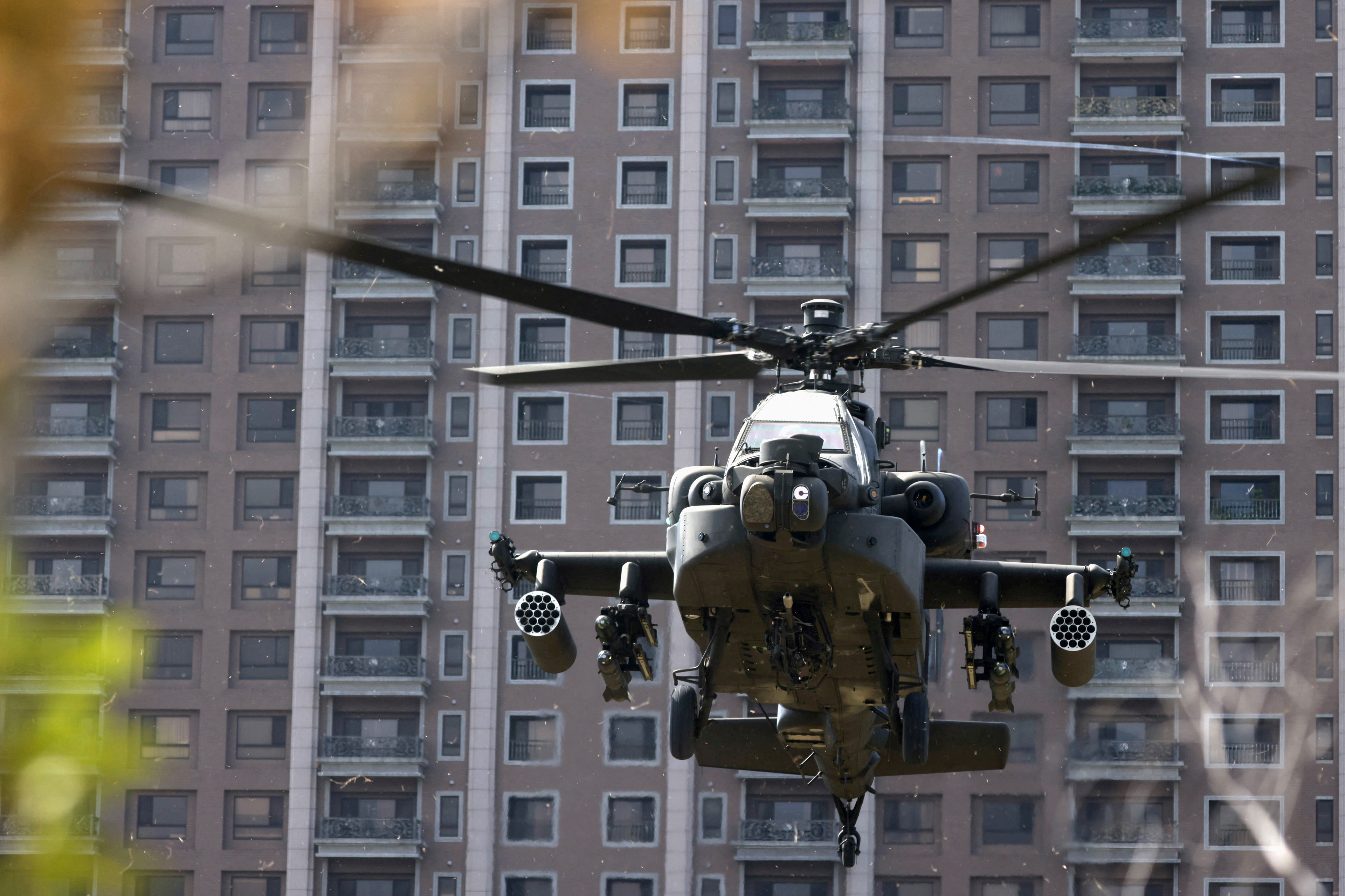 FILE PHOTO: An AH-64E Apache attack helicopter lands during 'Combat Readiness Week' drills in Hsinchu,