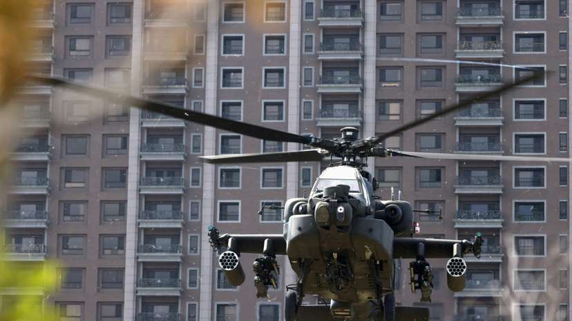 FILE PHOTO: An AH-64E Apache attack helicopter lands during 'Combat Readiness Week' drills in Hsinchu,