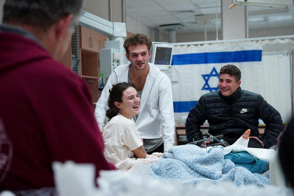 FILE PHOTO: Former hostages released from the Gaza Strip on November 29 reunite with loved ones in Israel