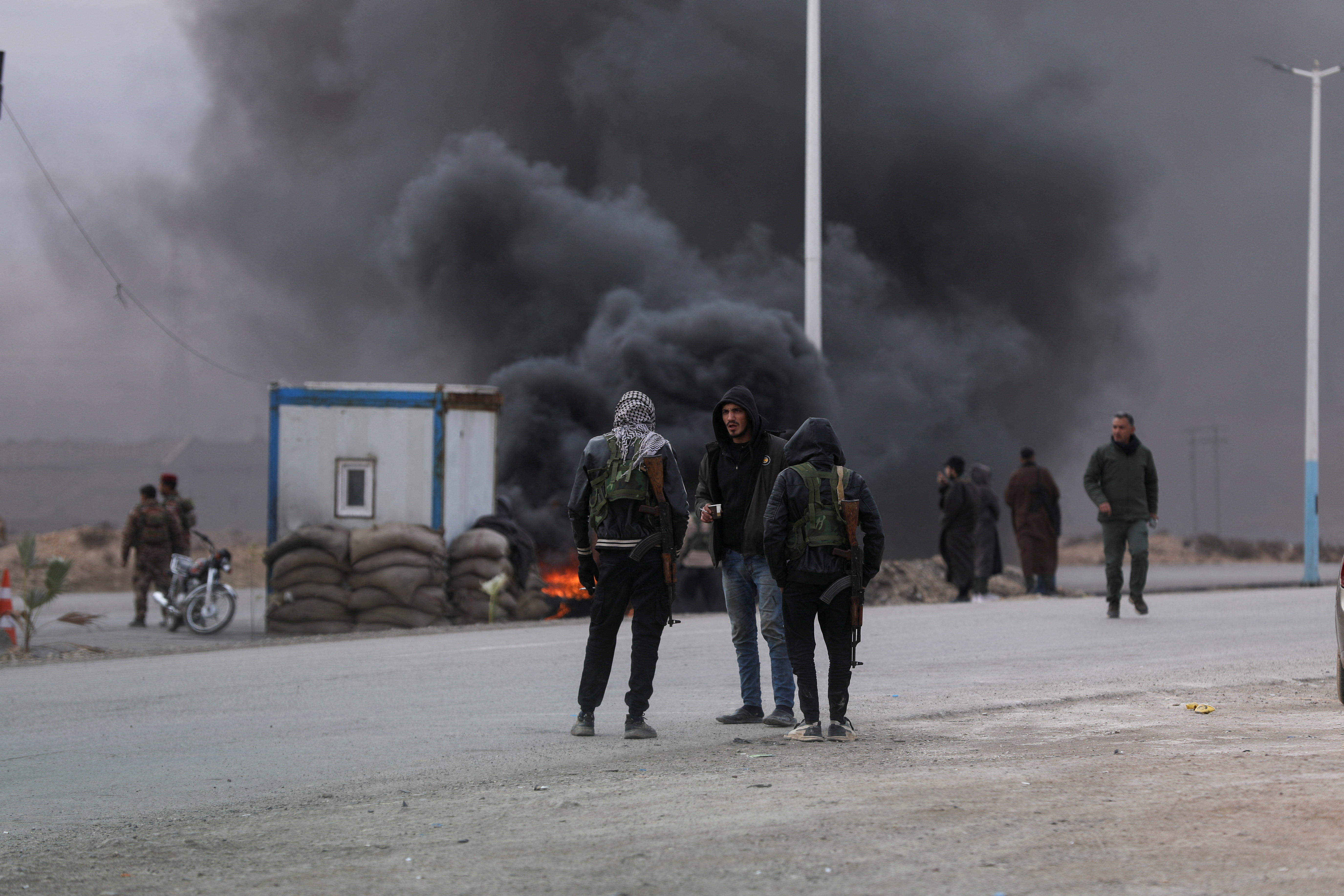 Syrian Democratic Forces (SDF) fighters are deployed in Taqba