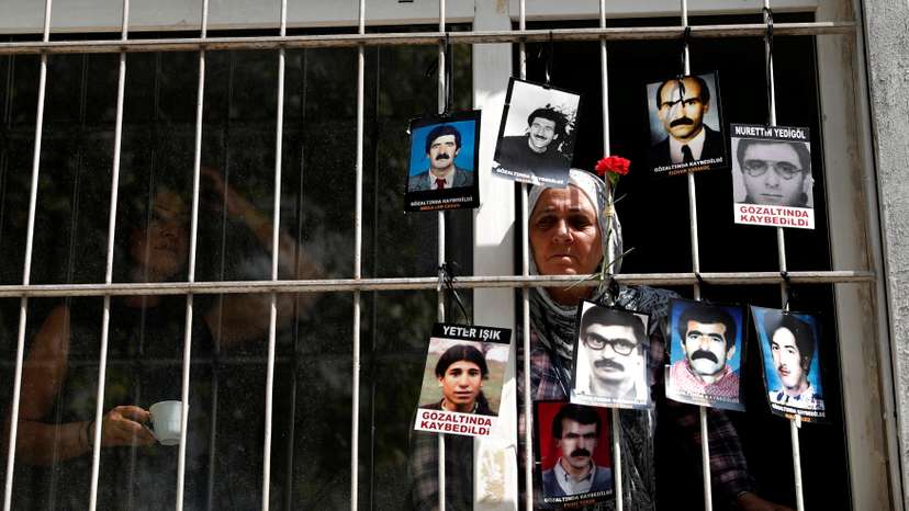 FILE PHOTO: A member of the Saturday Mothers looks out of the window of Human Rights Association after they were prevented by the security forces to march to Galatasaray Square in Istanbul