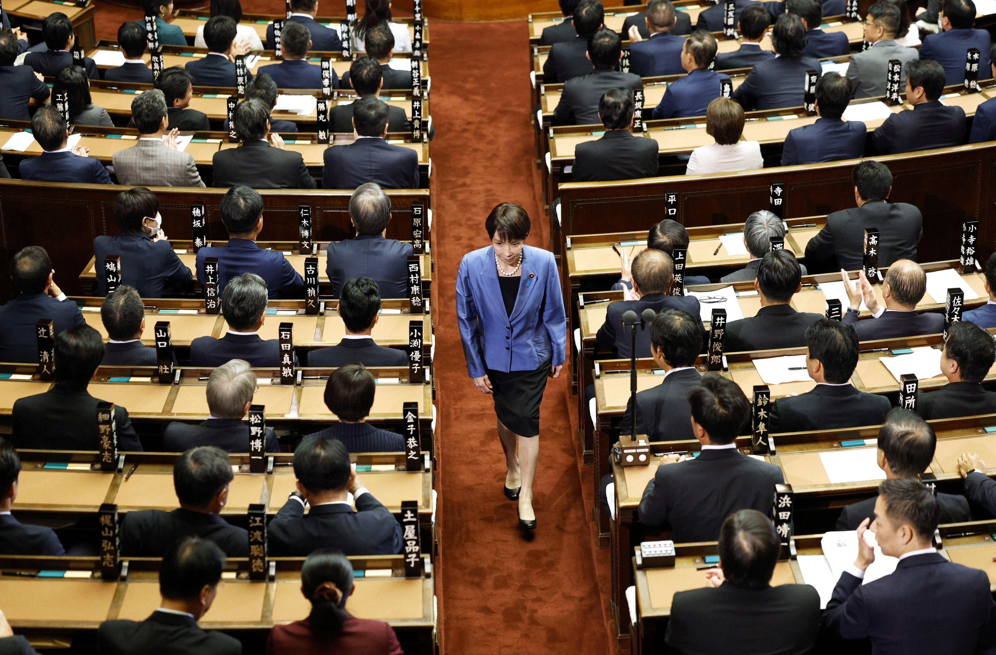 Sanae Takaichi, leader of the ruling Liberal Democratic Party, walks after casting a vote in an election to choose Japan's next prime minister at the Lower House of Parliament in Tokyo