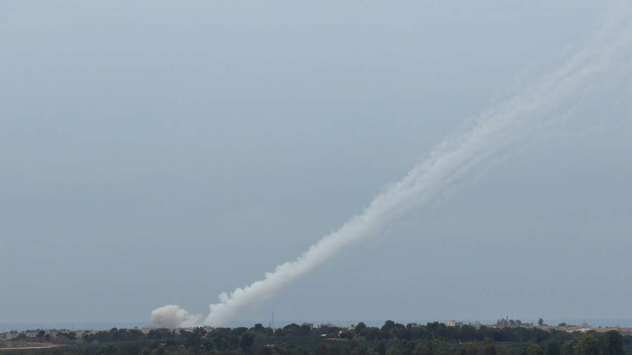 Smoke trails are seen as a salvo of rockets are launched from the Gaza Strip into Israel, as seen from southern Israel