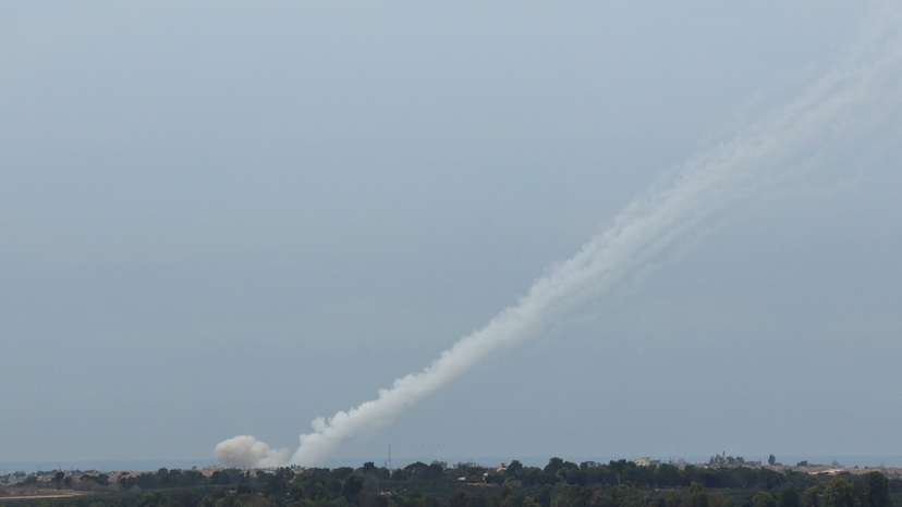 Smoke trails are seen as a salvo of rockets are launched from the Gaza Strip into Israel, as seen from southern Israel