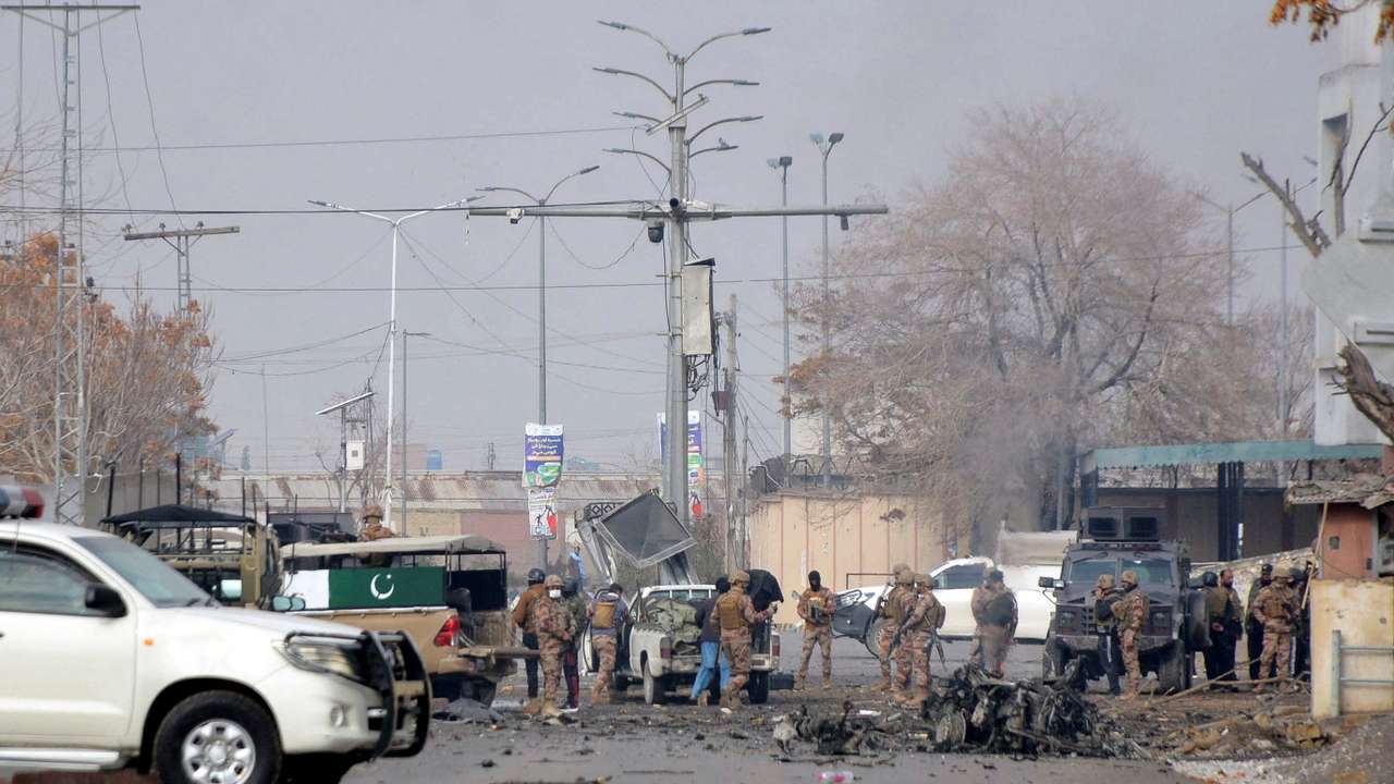 Army soldiers gather at the site, following millitant attacks, in Quetta