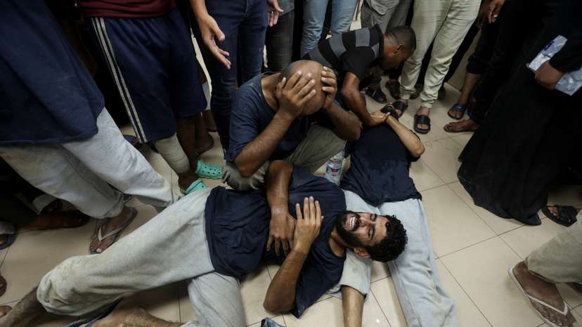 Palestinians who were detained by Israel arrive at Al-Aqsa Martyrs Hospital following their release, in Deir Al-Balah in the central Gaza Strip