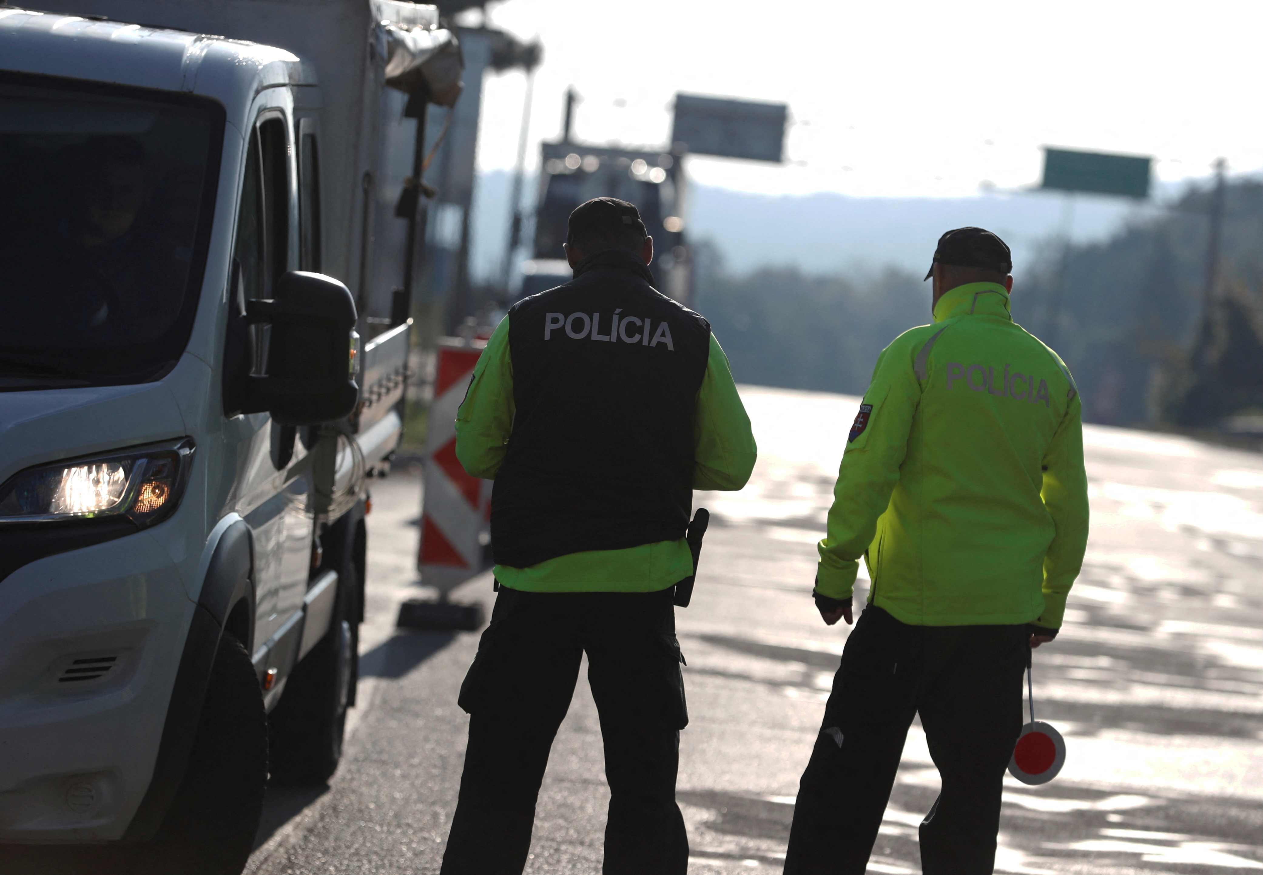 Slovakian police check a vehicle at the Slovakia-Hungary border in Sahy