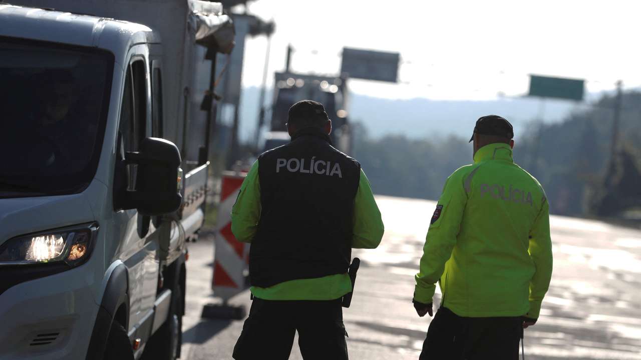 Slovakian police check a vehicle at the Slovakia-Hungary border in Sahy