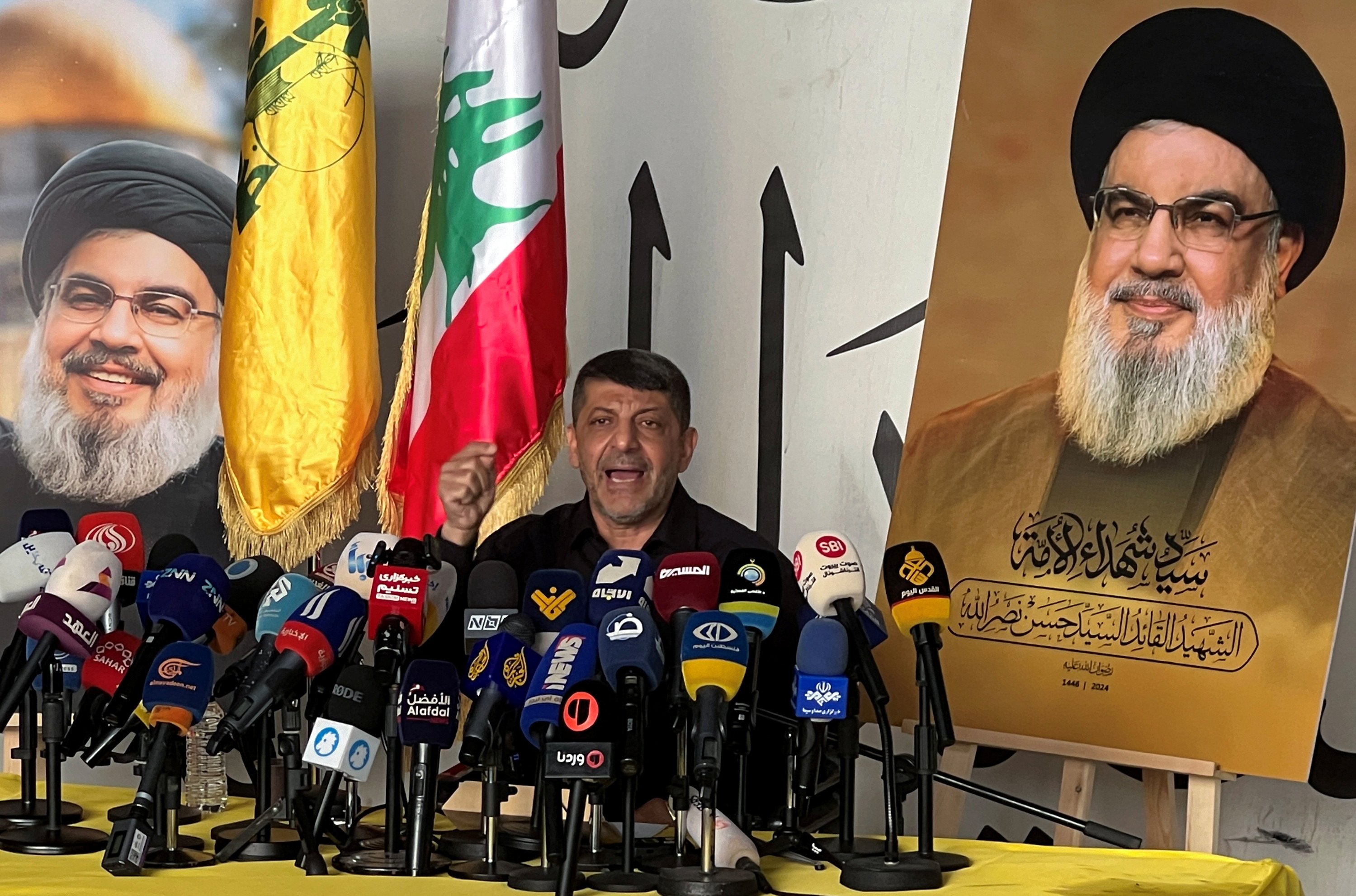 Head of Hezbollah's media office, Afif, speaks during a press conference in Beirut's southern suburbs