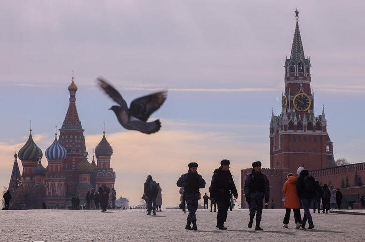 FILE PHOTO: People walk in Red Square in central Moscow