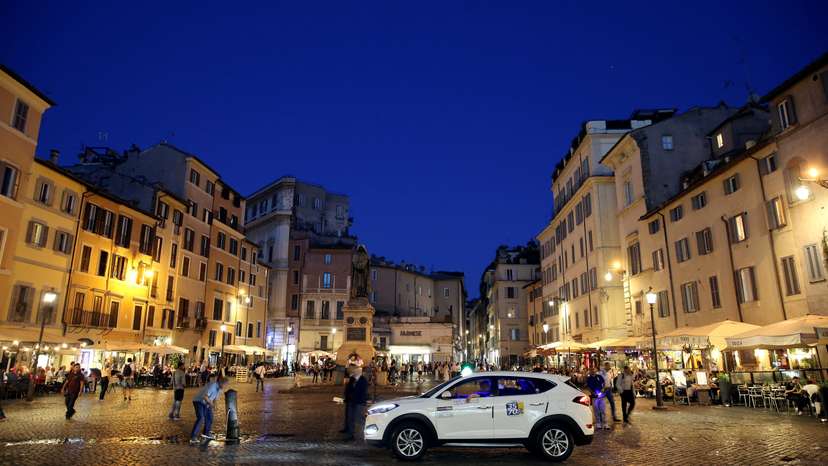 FILE PHOTO: A taxi driver wait for clients at Campo de Fiori square in downtown Rome