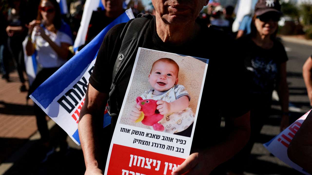 Family members, friends and supporters of Israeli hostages, take part in march at the outskirts of Tel Aviv
