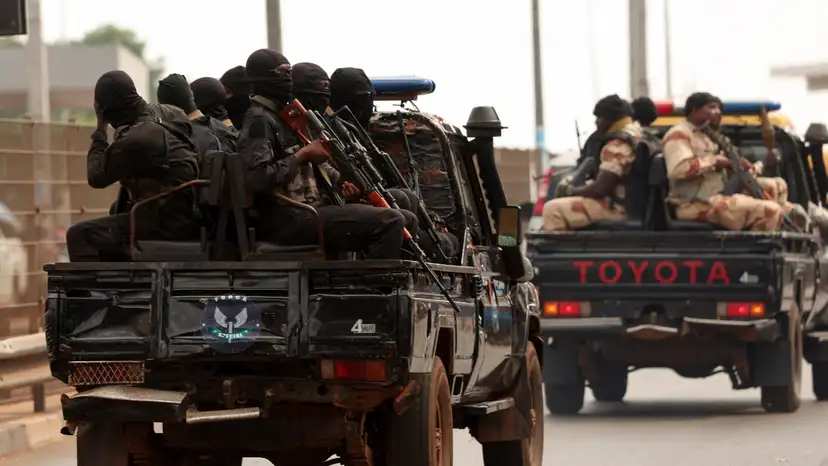 Soldiers patrol on the main road in Bissau
