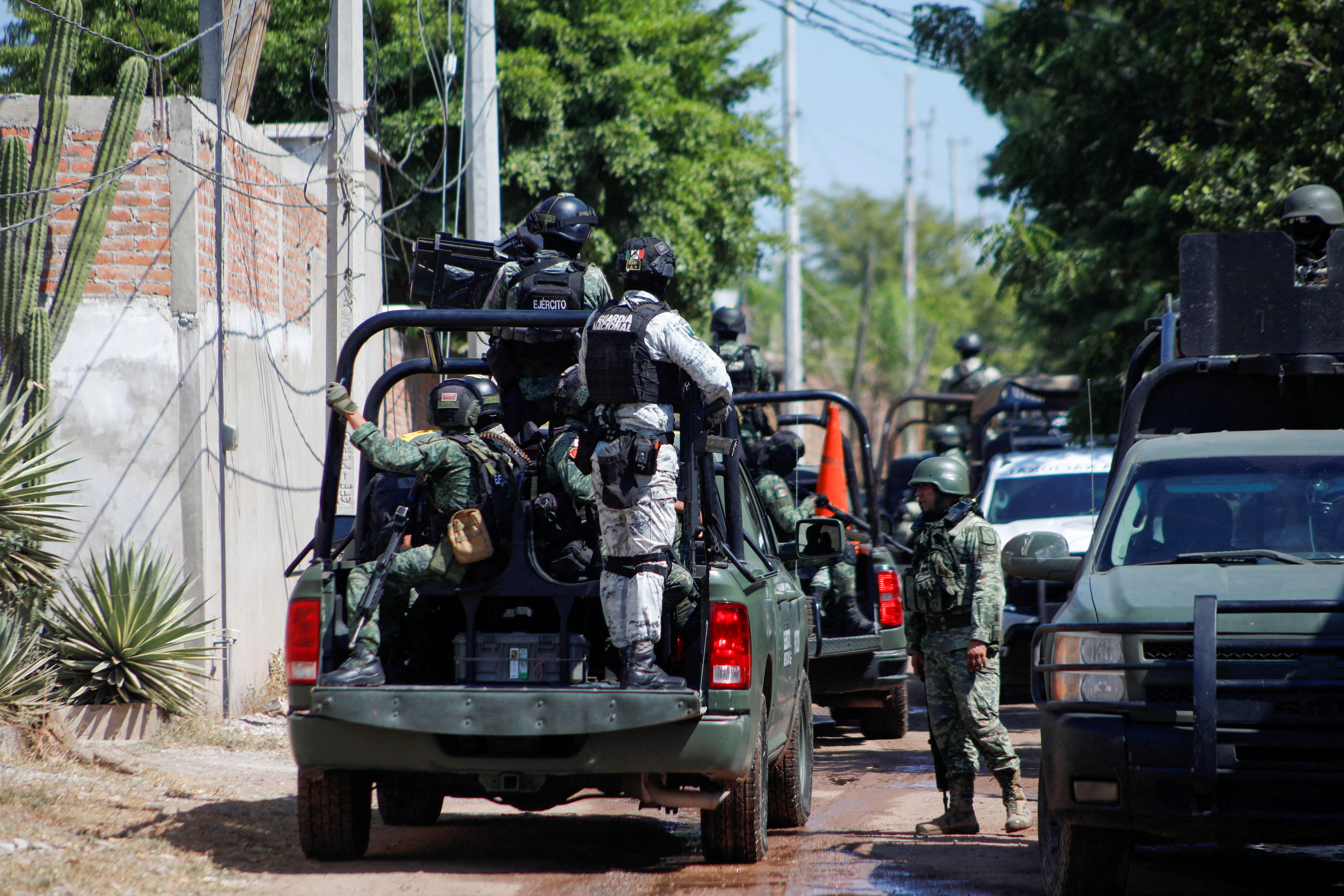 FILE PHOTO: Federal forces guard the perimeter of a scene following a shootout, in Culiacan