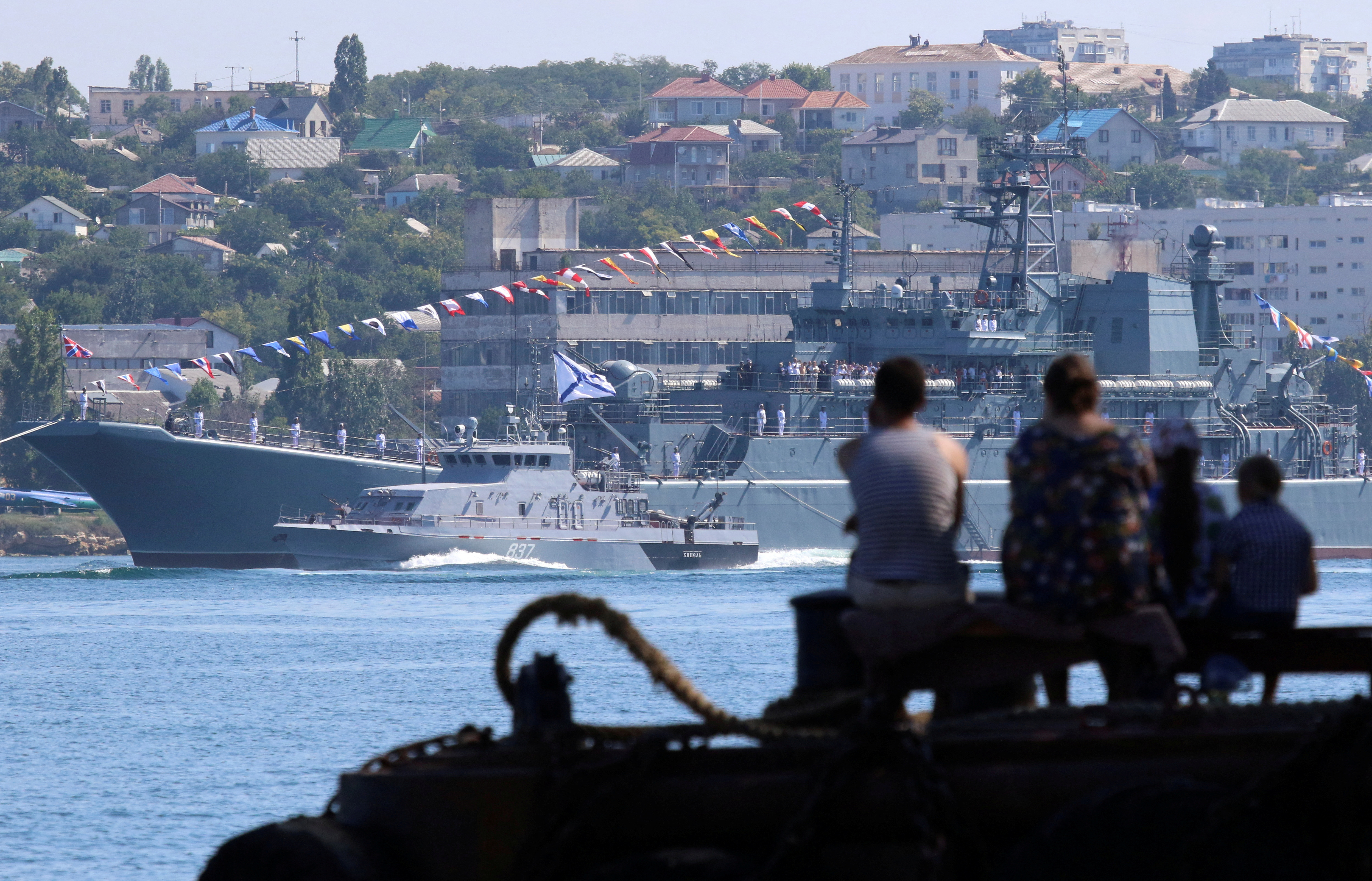 FILE PHOTO: People watch a rehearsal for the Navy Day parade in Sevastopol