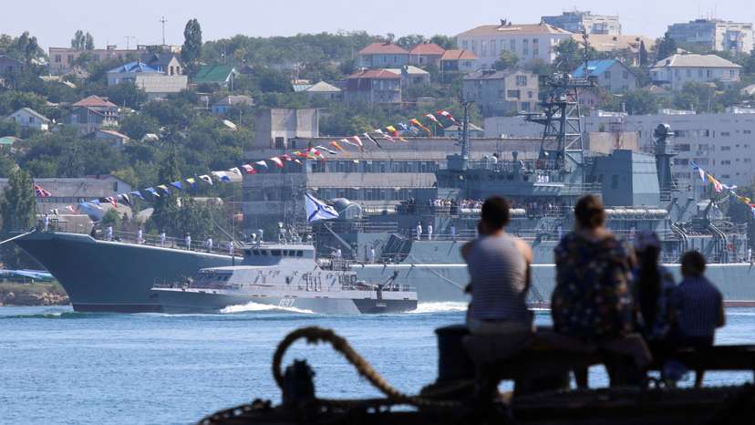 FILE PHOTO: People watch a rehearsal for the Navy Day parade in Sevastopol