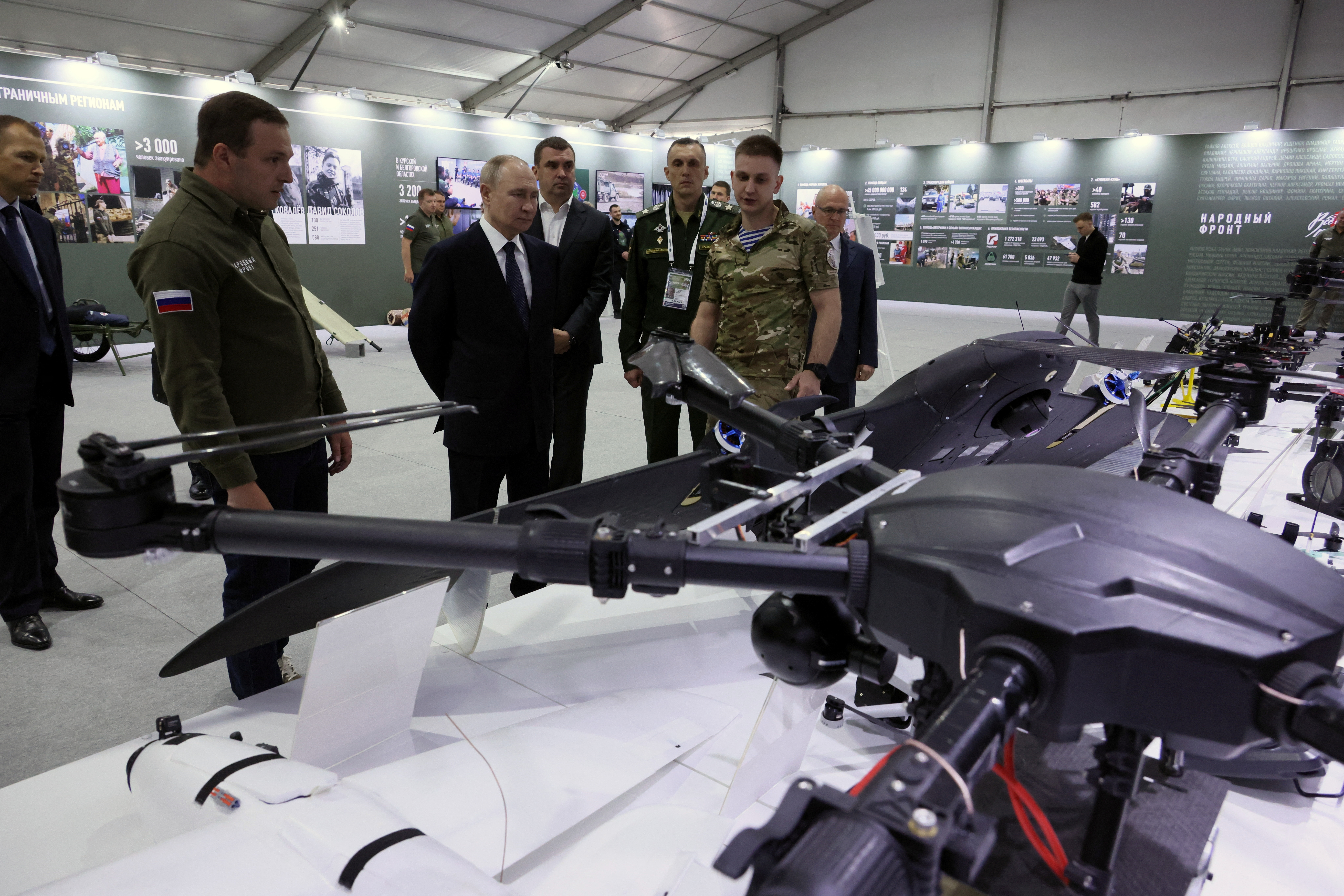 Russian President Vladimir Putin tours a military exhibition in Moscow