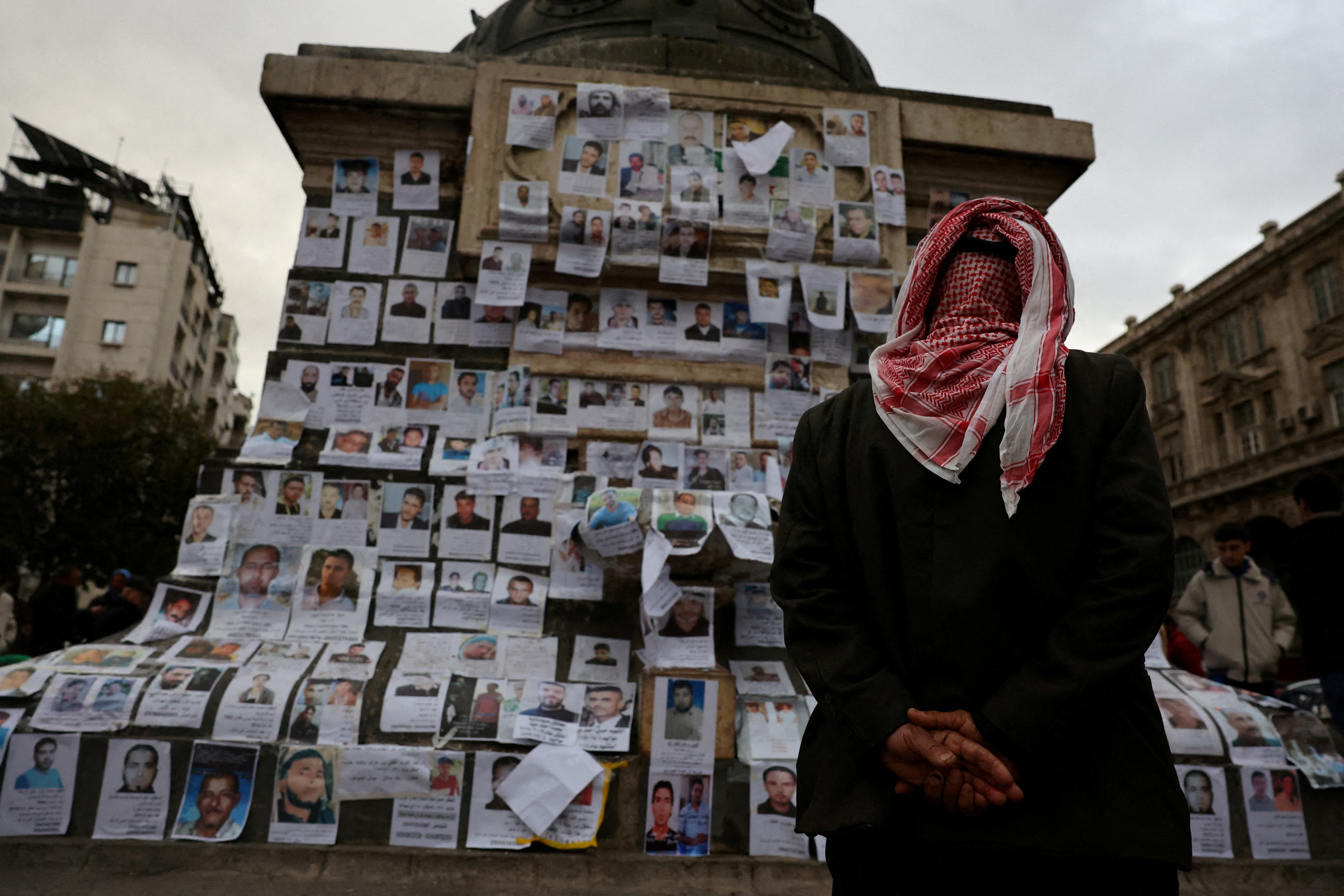 FILE PHOTO: People looking for missing relatives in Damascus