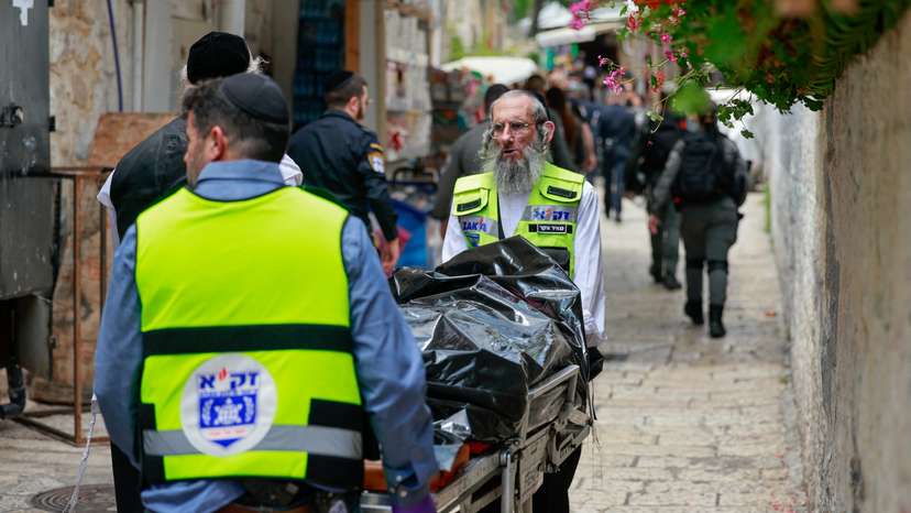 Israeli emergency responders work at the scene of a suspected stabbing attack, according to Israel's ambulance services, in Jerusalem